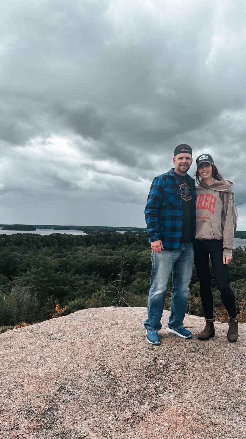 Shayna and Branden on the rocky overlook in Muskoka